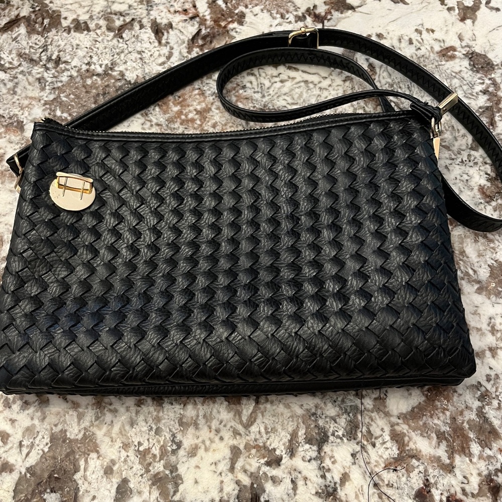 Cross body or shoulder purse. Used once. Adjustable strap.